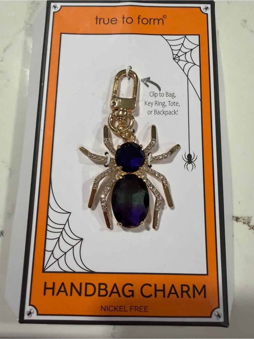 true to form Gold Spider Handbag Charm with Purple Gemstones